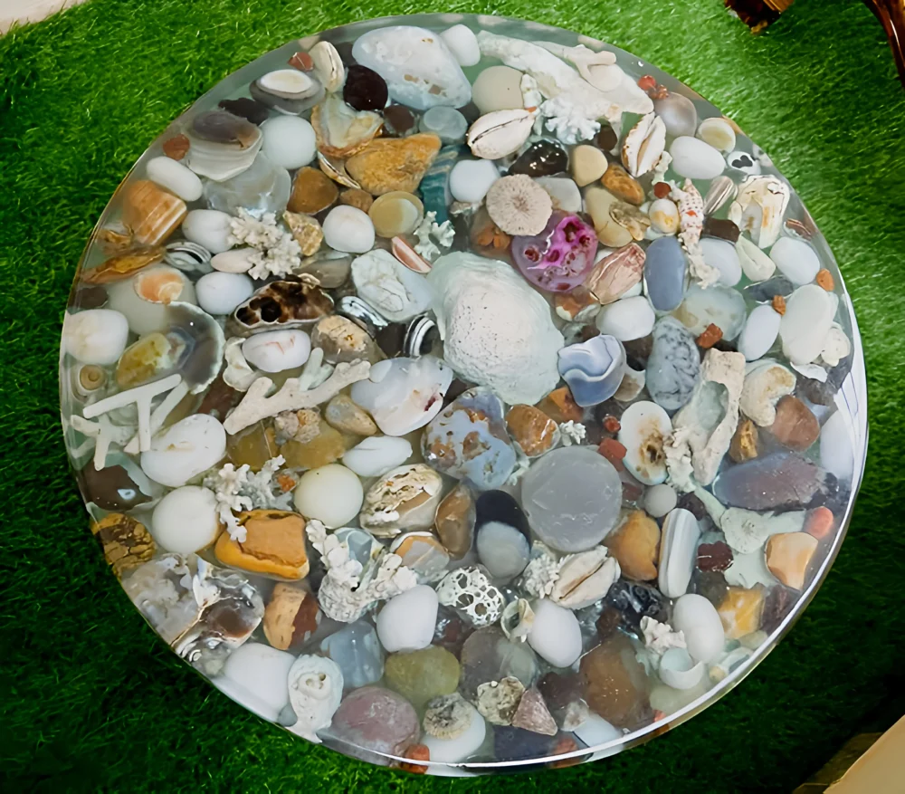 A beautifully crafted round resin coffee table with a nature-inspired design