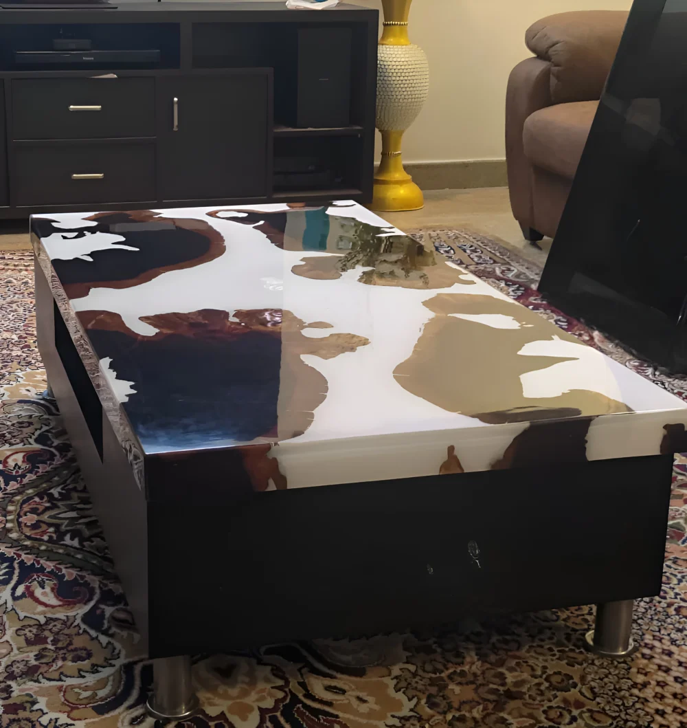 A rectangular coffee table with a resin-coated wooden top is displayed in a living room setting.