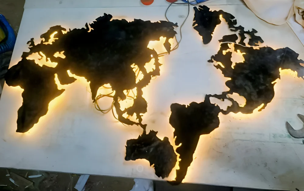 This stunning resin world map wall art features a beautifully crafted silhouette of the continents, set against a subtle white background